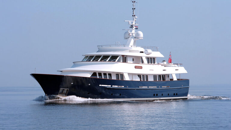 36m Royal Huisman Explorer Arcadia superyacht by Tony Castro Yachts with dark navy hull and white superstructure cruising on calm open water