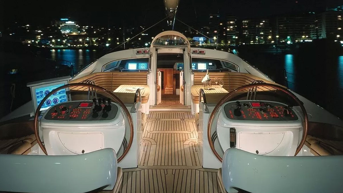 32m Red Sula sail custom yacht by Tony Castro Yachts with white hull and teak deck, heeling under large mainsail on deep blue open sea
