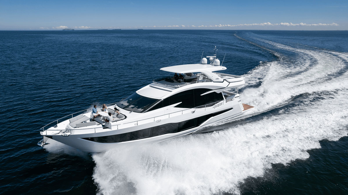 25m Galeon 800 Fly power yacht by Tony Castro Yachts cruising at sunset with sleek modern profile and illuminated superstructure reflected on calm water