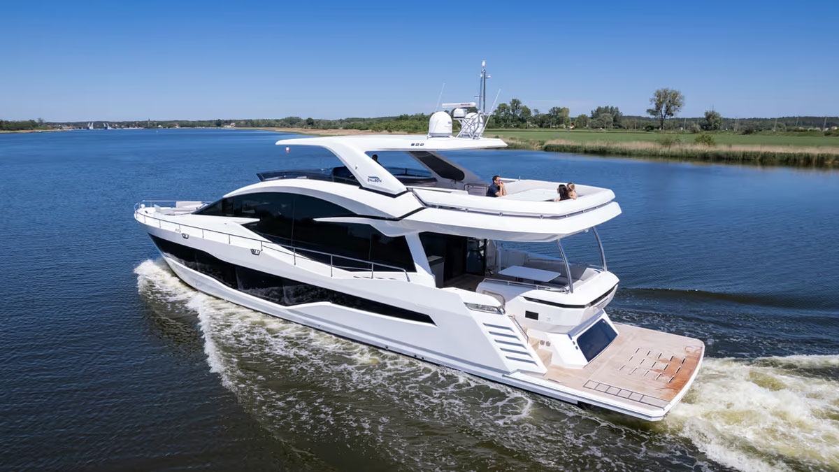 25m Galeon 800 Fly power yacht by Tony Castro Yachts cruising at sunset with sleek modern profile and illuminated superstructure reflected on calm water