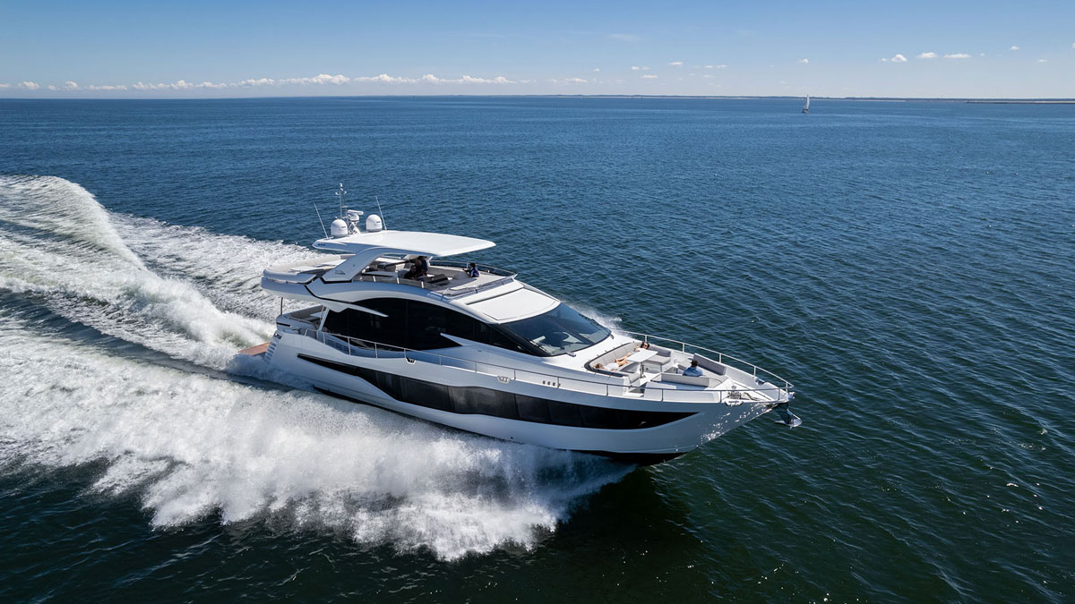 25m Galeon 800 Fly power yacht by Tony Castro Yachts cruising at sunset with sleek modern profile and illuminated superstructure reflected on calm water
